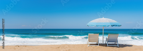 Beautiful Beach side view of the beautiful blue ocean water with waves during a bright sunny day and blue sky, folding chairs with sun umbrella