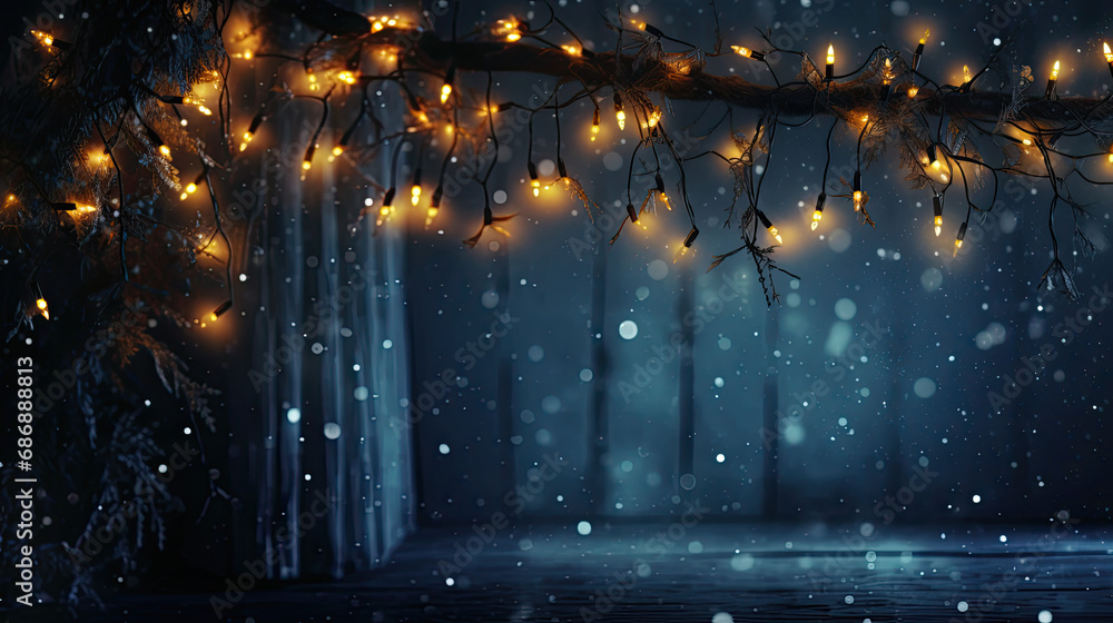 Capturing the essence of the season with twinkling Christmas garland lights against the backdrop of dark blue.