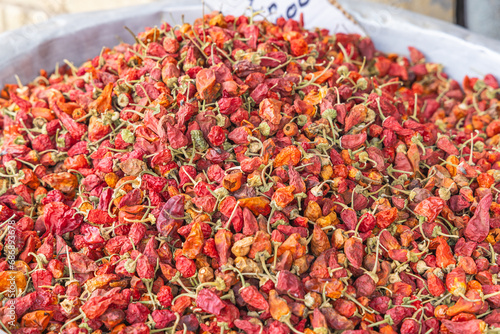 Dried red peppers for sale at the outdoor souk in Bir al Haffay. photo