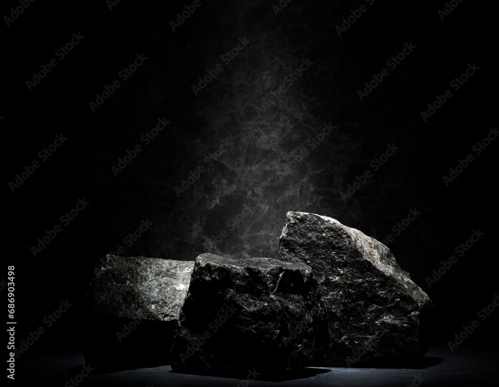 black stones for the podium on a dark background black stones for the podium on a dark background