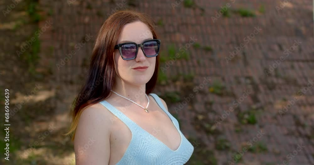 Open and inquisitive nature. Facial expression and body language. Portrait of young woman looking into camera. Sense of inner strength. Eye contact as desire to connect or engage on personal level. Open and inquisitive nature. Facial expression and body language. Portrait of young woman looking into camera. Sense of inner strength. Eye contact as desire to connect or engage on personal level.