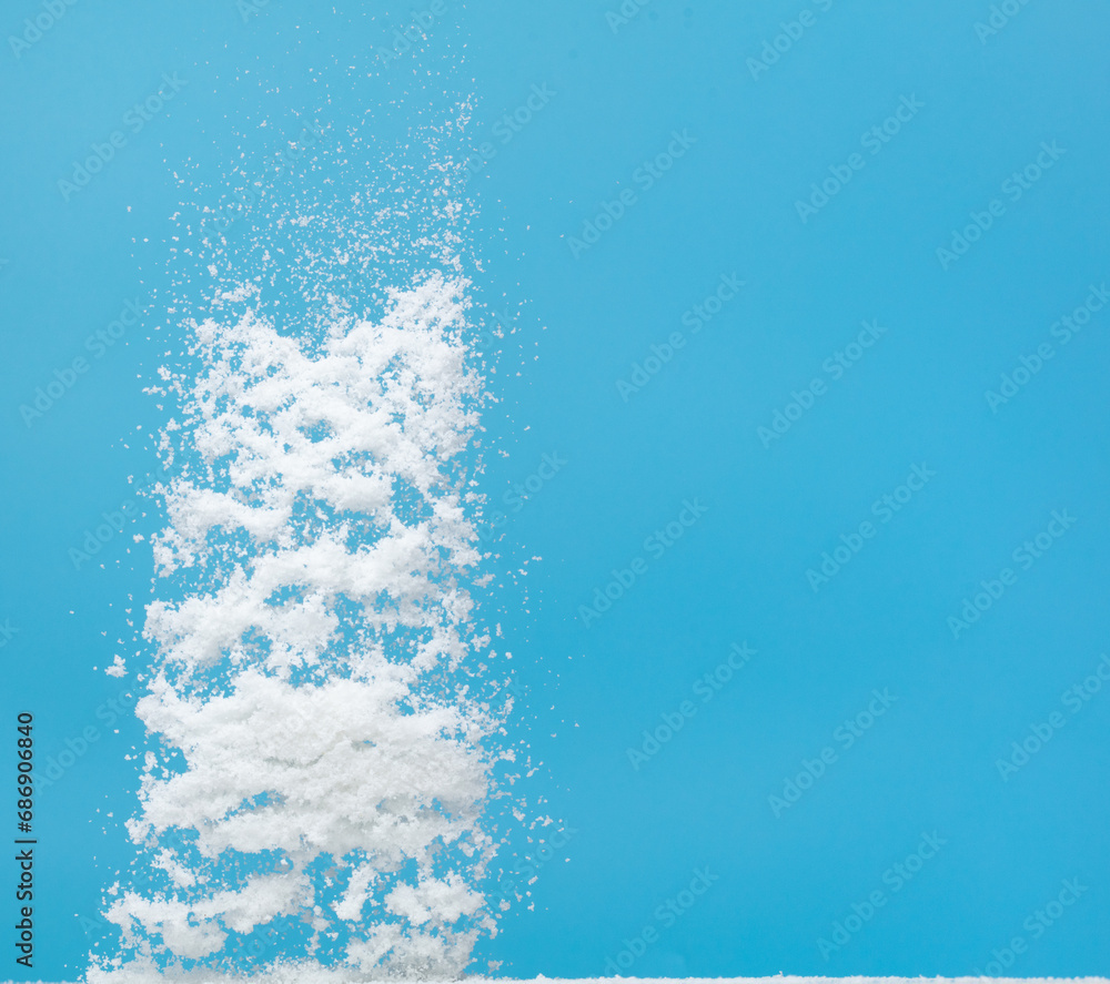 Photo image of falling down snow, heavy big small size snows. Freeze shot on blue sky winter background isolated overlay. Fluffy White snowflakes splash cloud in mid air. Real Snow throwing