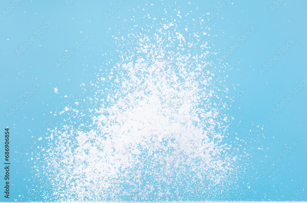 Photo image of explosion dust snow, heavy big small size snows. Freeze shot on blue sky winter background isolated overlay. Fluffy White snowflakes splash cloud in mid air. Real Snow throwing Photo image of explosion dust snow, heavy big small size snows. Freeze shot on blue sky winter background isolated overlay. Fluffy White snowflakes splash cloud in mid air. Real Snow throwing