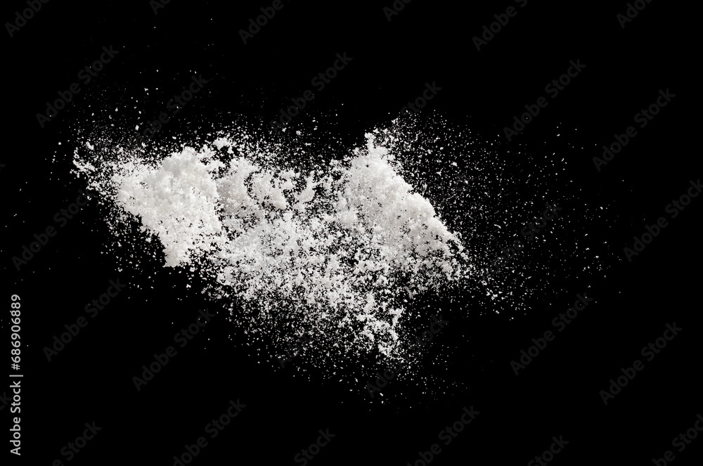 Photo image of throwing snow fly in air. Snows Freeze shot on black background isolated overlay. Fluffy White snowflakes splash cloud in falling down. Real Snow throwing shower