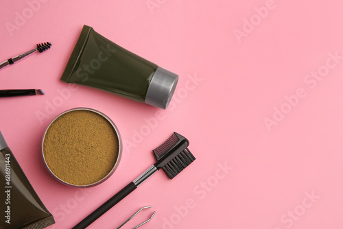 Fototapeta Naklejka Na Ścianę i Meble -  Flat lay composition with eyebrow henna and tools on pink background. Space for text