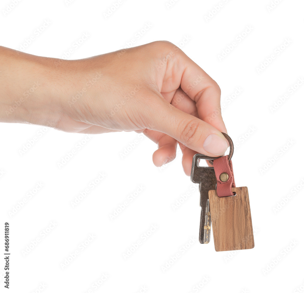 Woman holding key with wooden keychain on white background, closeup Woman holding key with wooden keychain on white background, closeup
