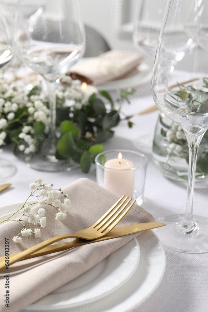 Beautiful table setting with floral decor, closeup Beautiful table setting with floral decor, closeup