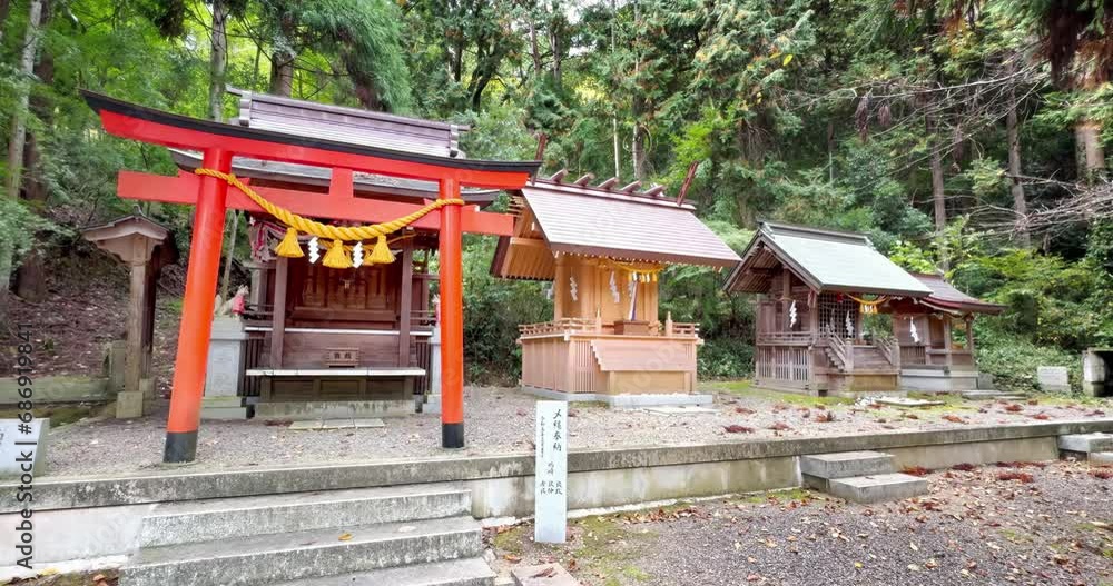 A Torii gateway, a traditional Japanese gate, found at the entrance of a Shinto shrine. A Torii gateway, a traditional Japanese gate, found at the entrance of a Shinto shrine.