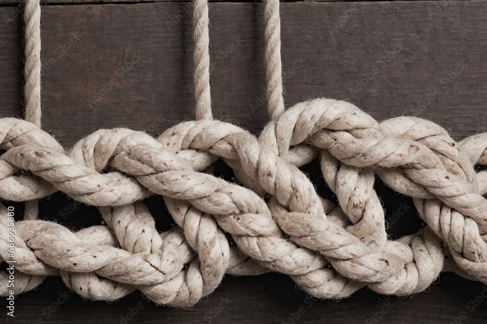 twisted cotton rope knot on a wooden background