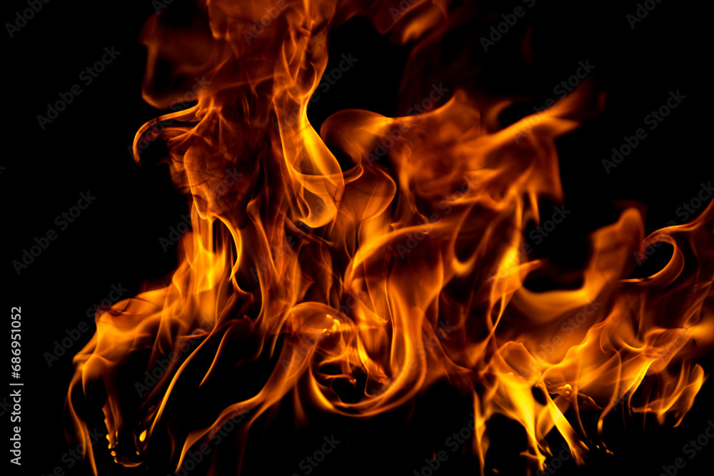 Fire flames isolated on black background. Fire burn flame isolated, flaming burning art design concept with space for text.