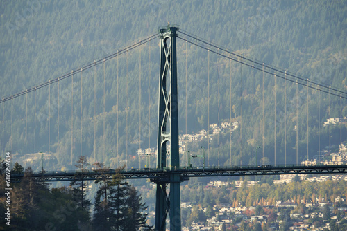Beautiful view of the Lions Gate Bridge connecting the North Shore with Downtown Vancouver as seen from Stanley Park during a fall season in Vancouver, British Columbia, Canada