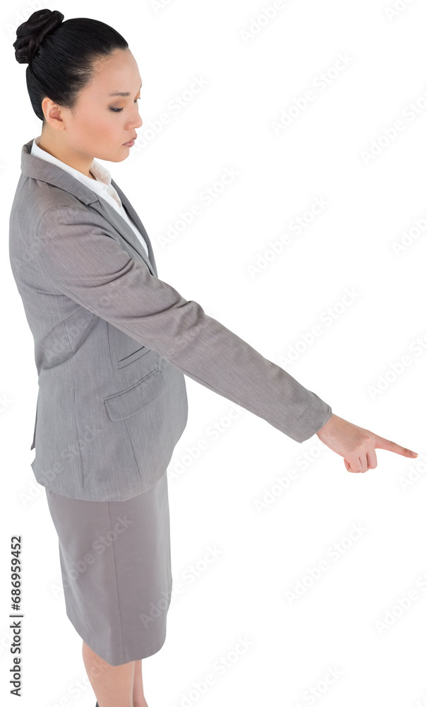 Digital png photo of serious asian businessman pointing finger on transparent background Digital png photo of serious asian businessman pointing finger on transparent background