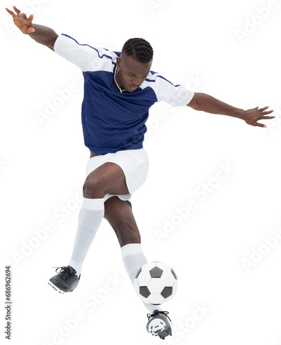 Digital png photo of african american male soccer player kicking ball on transparent background