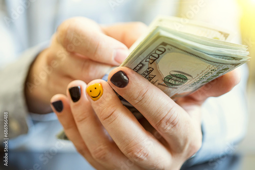 Businessman counts money in hands. concept of the joy of salary and money. A man with painted fingernails is holding cash. photo