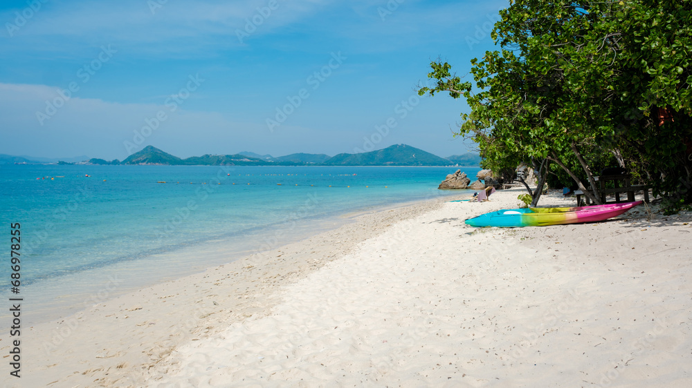 a colorful kayak on the beach of Ko Kham Island Sattahip Chonburi Samaesan Thailand.