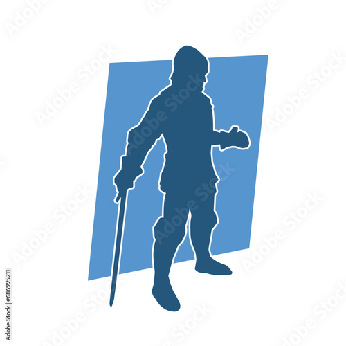 Silhouette of a male warrior wearing war armor suit in action pose using a sword weapon.