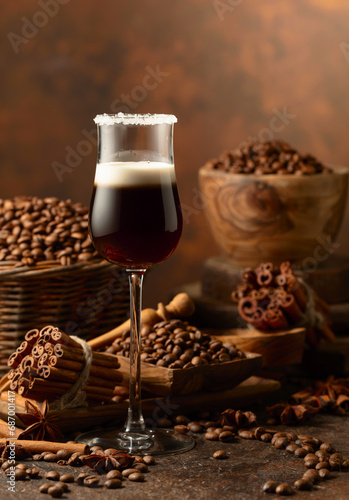 Coffee liqueur with cream on a brown background.