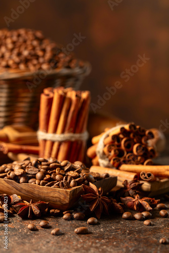 Coffee beans with spices on a brown vintage background.