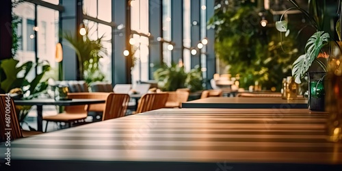 Contemporary dining experience. Modern wooden table and chairs set in stylish and elegant restaurant interior. Urban elegance. Empty desk and chair in interior with beautiful design and ambiance photo