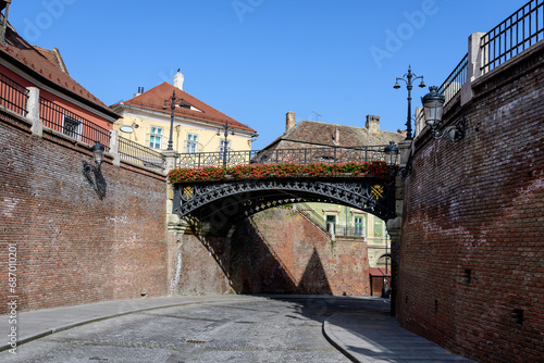 The Bridge of Lies (Podul Minciunilor) near the Small Square (Piata Mica) in the historical center of the Sibiu city in Transylvania (Transilvania) region of Romania, in a sunny summer day..