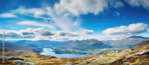 Panoramic views of Loch Daimh and mountain summits from Meall Buidhe in Scottish Highlands. photo
