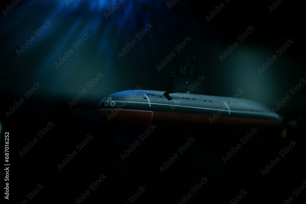 Submarine sailing in the dark sea water of the ocean
