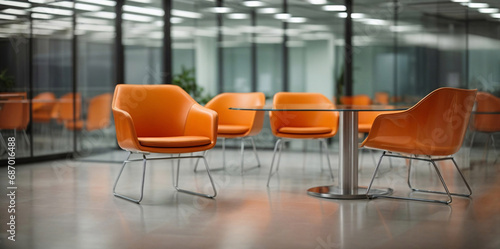 Blurred office glass interior space with orange chairs background. Blurred of office