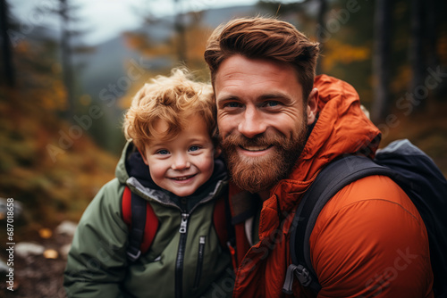 cheerful bearded man with redhead son looking at camera, happy family trip © Alex