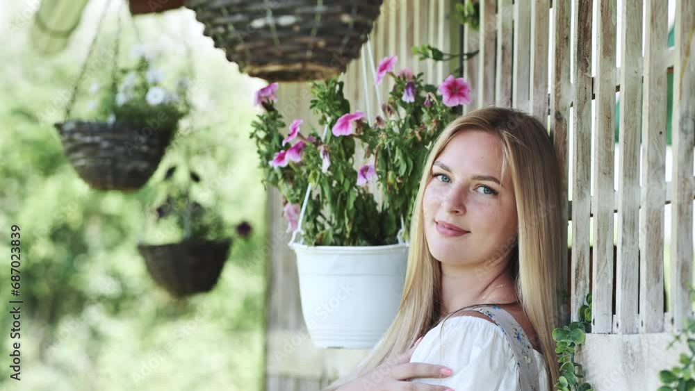 German girl posing outside the house. German girl posing outside the house.