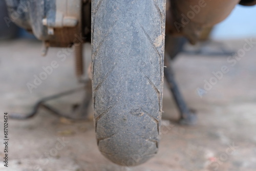 Fototapeta Naklejka Na Ścianę i Meble -  Motorcycle tires with smooth tread are deteriorating