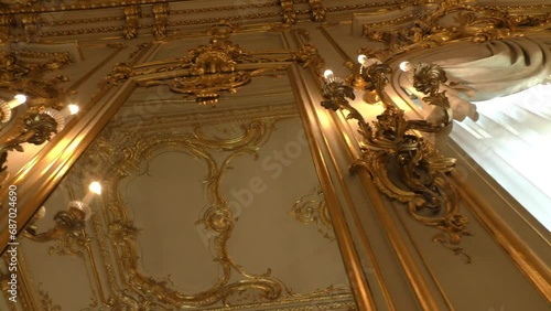 Interior of the palace is decorated with old mirrors and gilding. Vintage wall of the royal time.