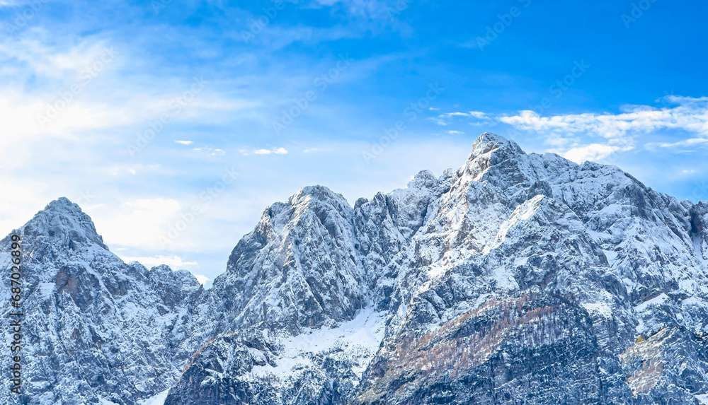 Banner travel with mountain view of alpine as snow-capped mount peaks in Winter mountains scene Banner travel with mountain view of alpine as snow-capped mount peaks in Winter mountains scene