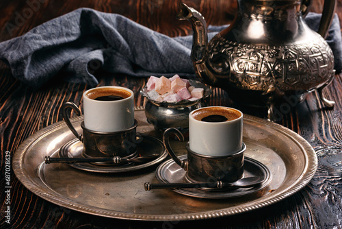 still life with a middle eastern coffee set on wooden table photo