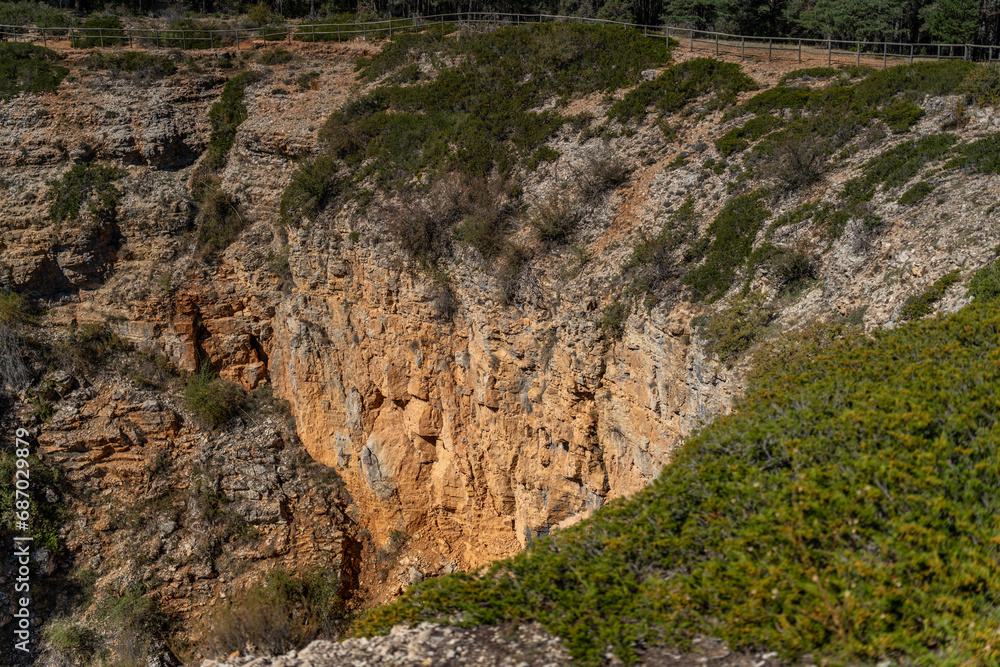 Rugged Cliffside Landscape with Lush Green Vegetation Rugged Cliffside Landscape with Lush Green Vegetation
