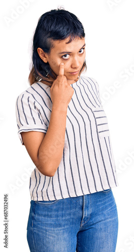 Young woman wearing casual clothes pointing to the eye watching you gesture, suspicious expression