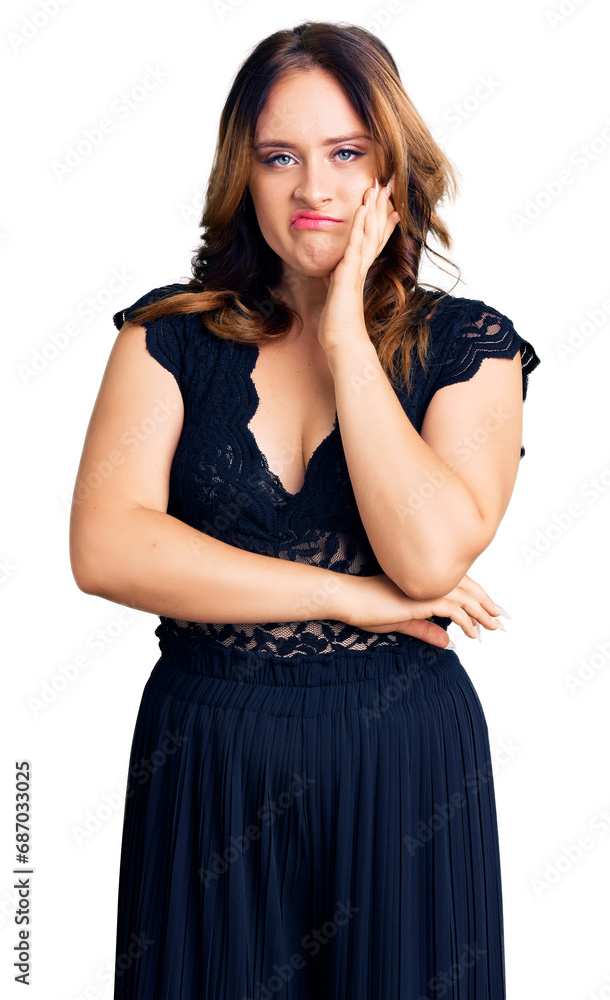 Young beautiful caucasian woman wearing elegant dress thinking looking tired and bored with depression problems with crossed arms. Young beautiful caucasian woman wearing elegant dress thinking looking tired and bored with depression problems with crossed arms.