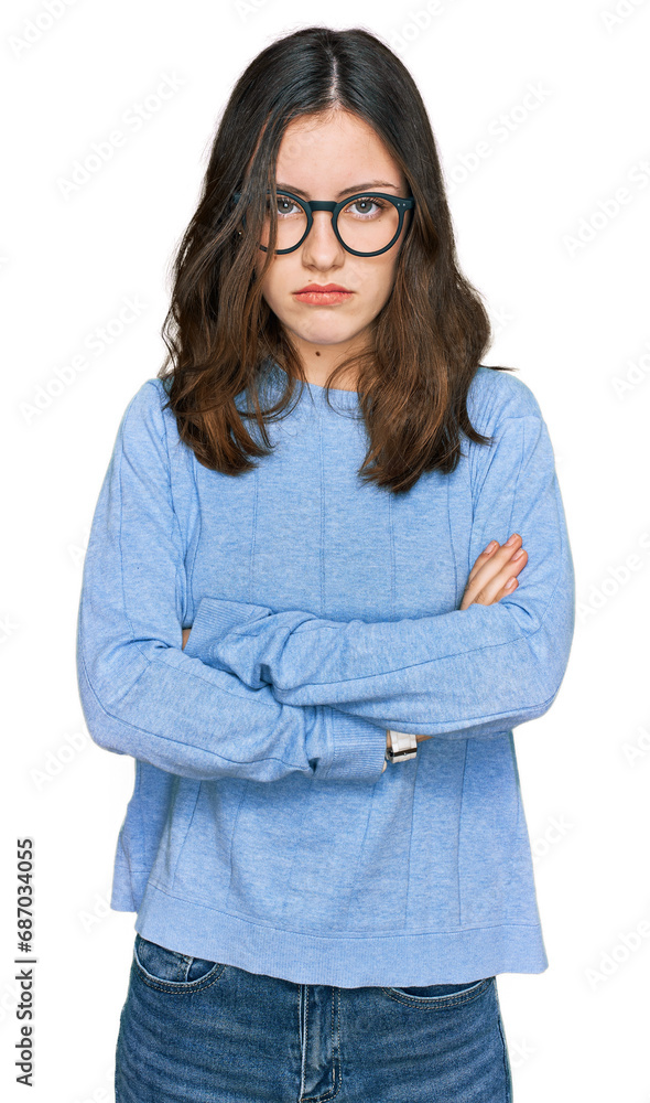 Young beautiful woman wearing casual clothes and glasses skeptic and nervous, disapproving expression on face with crossed arms. negative person.