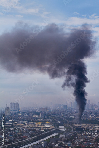 rising smoke from fire in the city