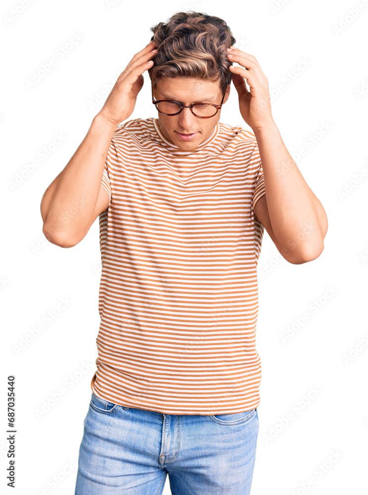 Young handsome man wearing casual clothes and glasses with hand on head for pain in head because stress. suffering migraine. Young handsome man wearing casual clothes and glasses with hand on head for pain in head because stress. suffering migraine.