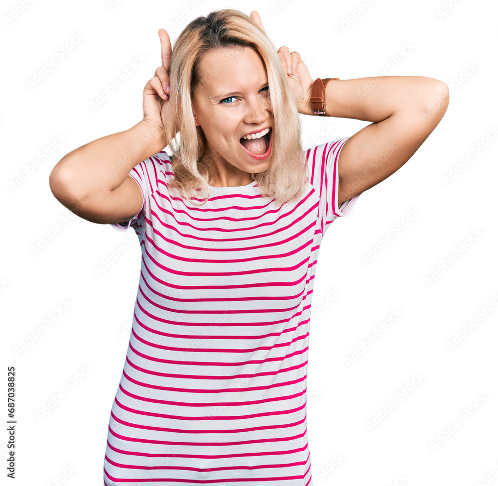 Young caucasian woman wearing casual clothes posing funny and crazy with fingers on head as bunny ears, smiling cheerful Young caucasian woman wearing casual clothes posing funny and crazy with fingers on head as bunny ears, smiling cheerful