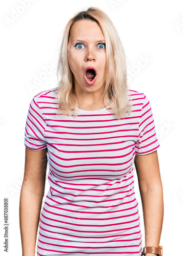 Young caucasian woman wearing casual clothes afraid and shocked with surprise and amazed expression, fear and excited face.