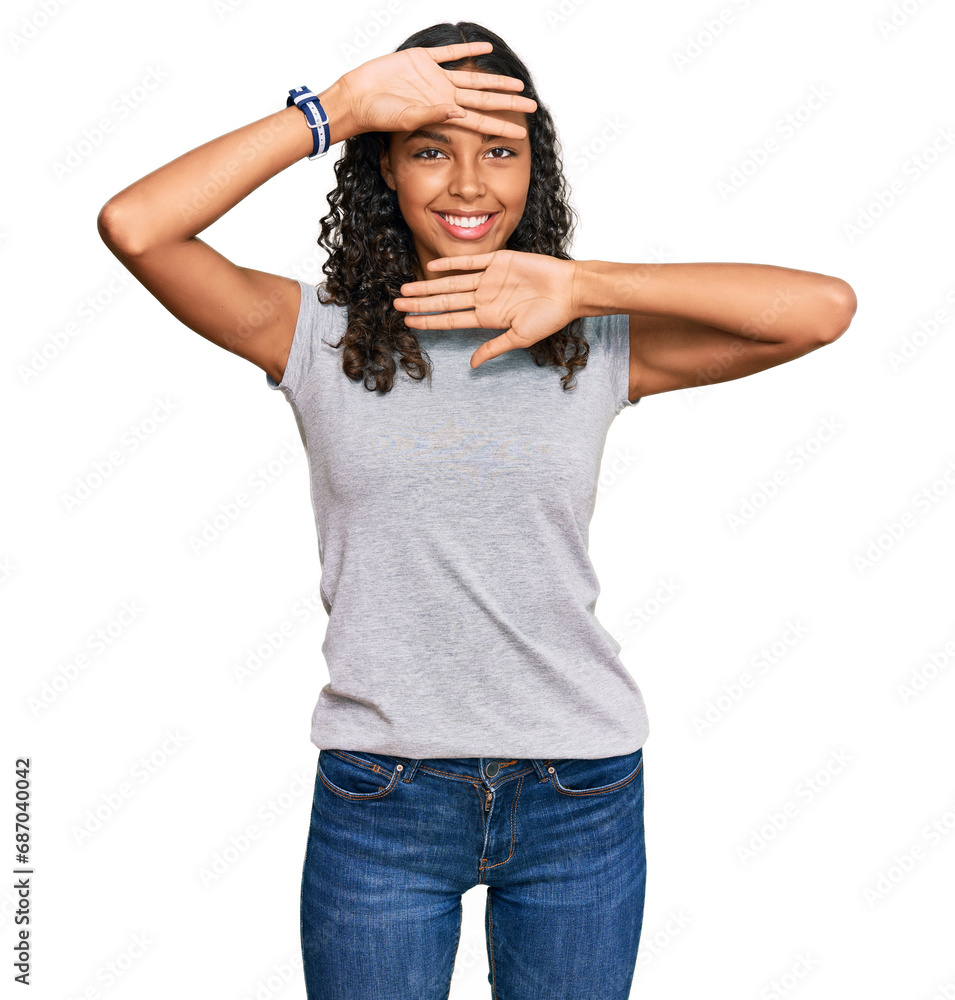 Young african american girl wearing casual clothes smiling cheerful playing peek a boo with hands showing face. surprised and exited Young african american girl wearing casual clothes smiling cheerful playing peek a boo with hands showing face. surprised and exited