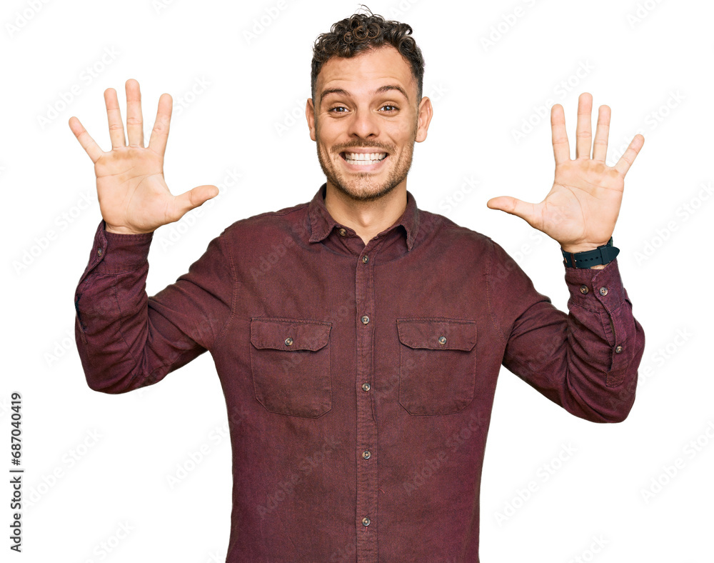 Young hispanic man wearing casual clothes showing and pointing up with fingers number ten while smiling confident and happy. Young hispanic man wearing casual clothes showing and pointing up with fingers number ten while smiling confident and happy.