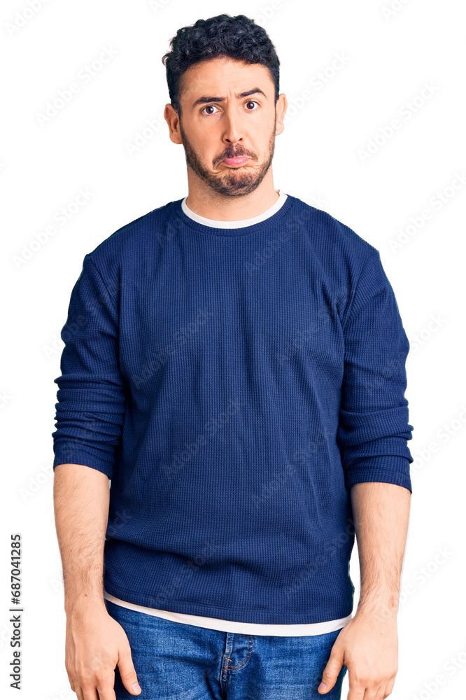 Young hispanic man wearing casual clothes depressed and worry for distress, crying angry and afraid. sad expression. Young hispanic man wearing casual clothes depressed and worry for distress, crying angry and afraid. sad expression.