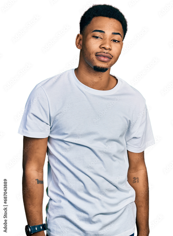 Young african american man wearing casual white t shirt looking sleepy and tired, exhausted for fatigue and hangover, lazy eyes in the morning. Young african american man wearing casual white t shirt looking sleepy and tired, exhausted for fatigue and hangover, lazy eyes in the morning.