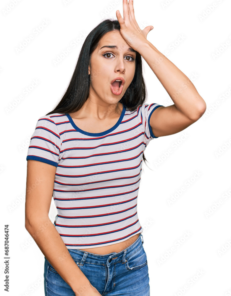 Young hispanic girl wearing casual striped t shirt surprised with hand on head for mistake, remember error. forgot, bad memory concept. Young hispanic girl wearing casual striped t shirt surprised with hand on head for mistake, remember error. forgot, bad memory concept.