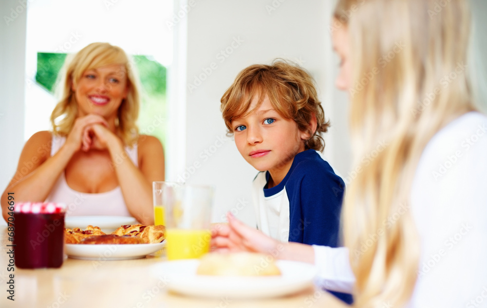 Happy family, morning and breakfast on weekend, portrait and eating for nutrition, orange juice and meal. Mother, children and enjoying food together for hunger, health and energy for good day Happy family, morning and breakfast on weekend, portrait and eating for nutrition, orange juice and meal. Mother, children and enjoying food together for hunger, health and energy for good day
