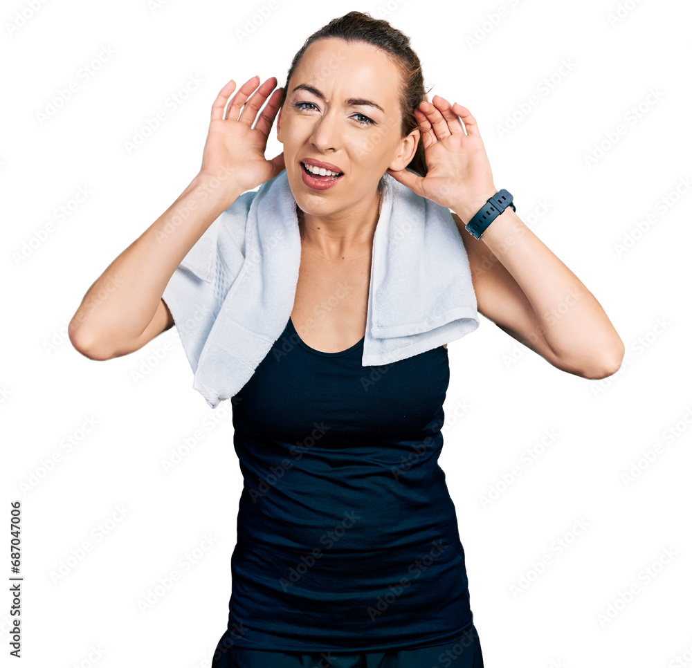 Young caucasian woman wearing sportswear and towel trying to hear both hands on ear gesture, curious for gossip. hearing problem, deaf Young caucasian woman wearing sportswear and towel trying to hear both hands on ear gesture, curious for gossip. hearing problem, deaf