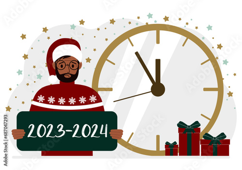 5 minutes for the new year. A man holds a poster with the text 2023-2024.