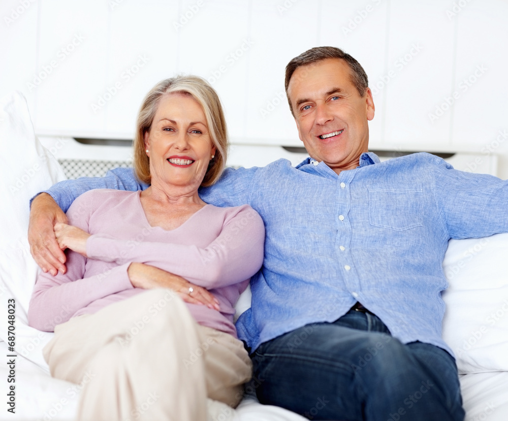Senior, couple and portrait or happy on sofa with support, relationship and marriage in retirement home. Elderly, man and woman with smile on couch in living room with trust, care and love in house Senior, couple and portrait or happy on sofa with support, relationship and marriage in retirement home. Elderly, man and woman with smile on couch in living room with trust, care and love in house